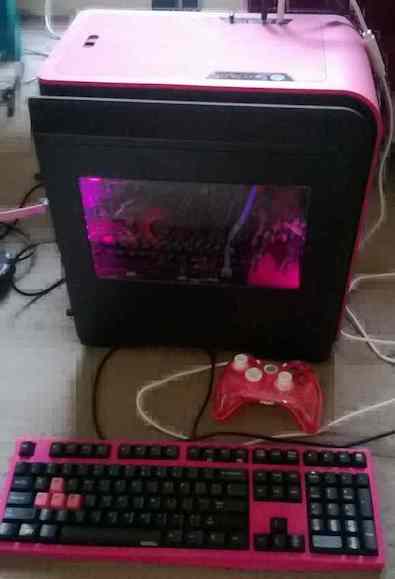 a pink computer, with a pink keyboard and a pink XBox controller