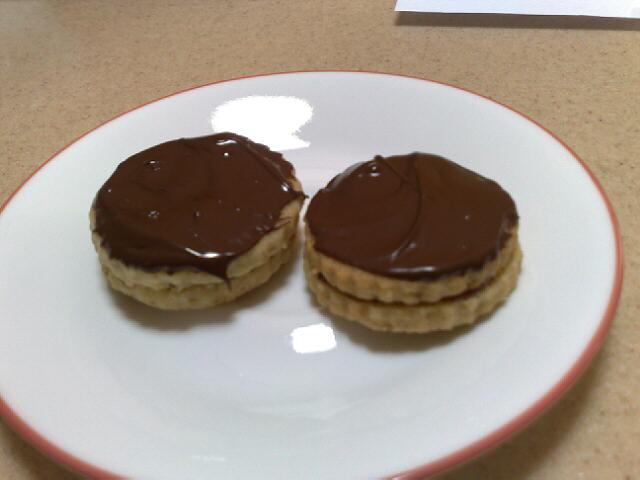 Walnut shortbread joined with redcurant jelly and topped with chocolate